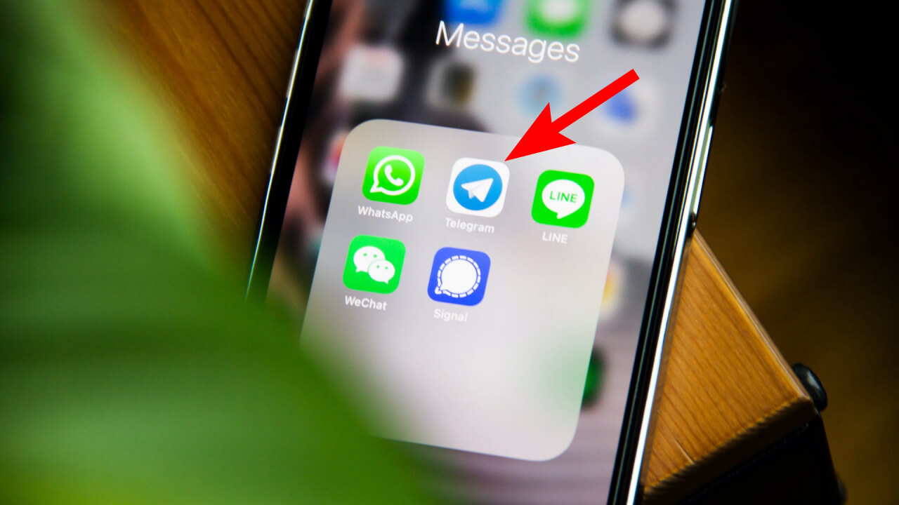 arrow pointing on telegram channel on screen display of messaging apps